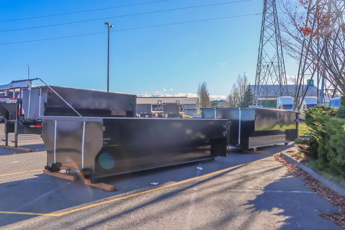 Roll-off dumpster ready for waste disposal at job site for 4 Yard Dumpster Rental in Bedford